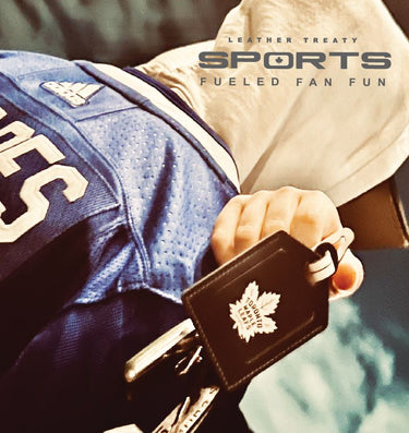 Man holding leather Maple Leafs luggage tag